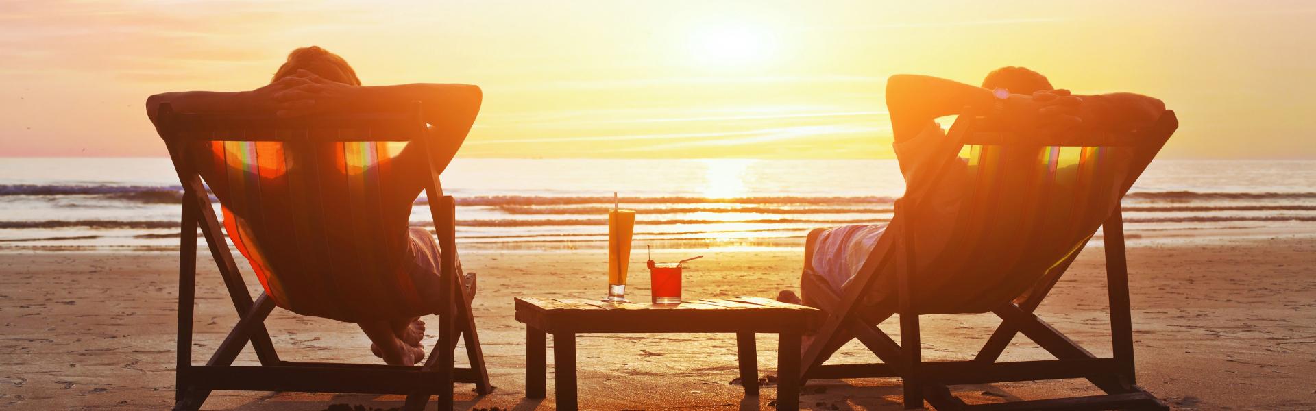 playa banner amanecer tumbonas